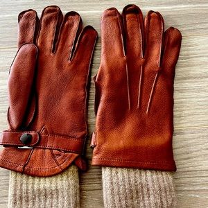Never-worn brown leather gloves with wool inserts.